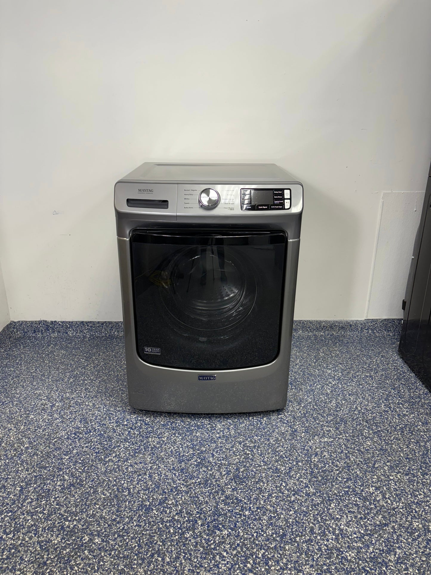 Front view of the MAYTAG MHW5630HC front-load washer in Metallic Slate finish, available in Overland Park, KS.