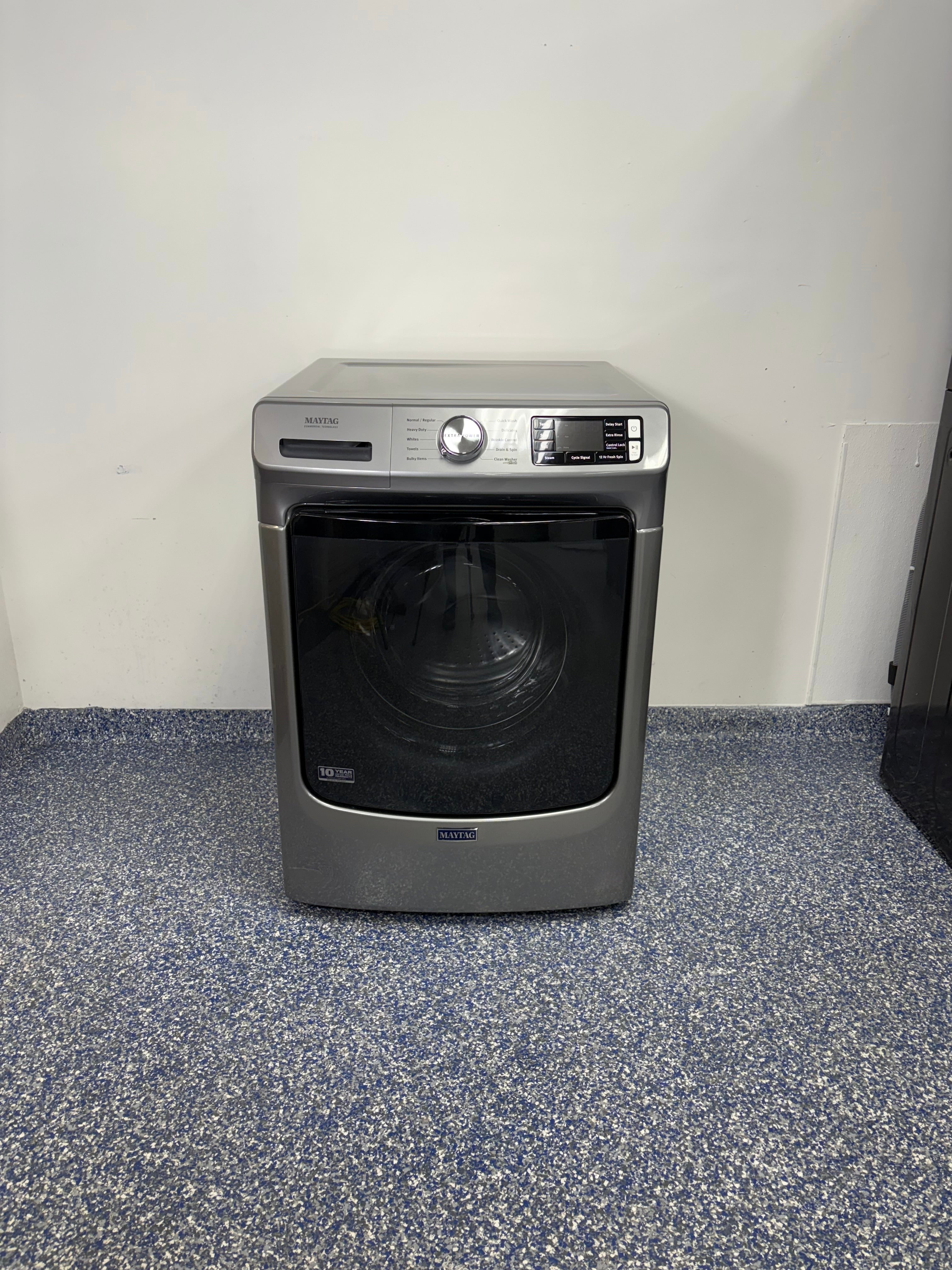 Front view of the MAYTAG MHW5630HC front-load washer in Metallic Slate finish, available in Overland Park, KS.