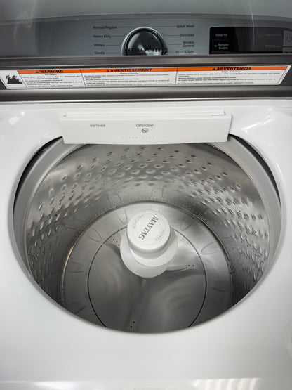 A close-up of the durable stainless steel wash basket and agitator inside the MVW6230HW washer, designed for tough messes. On sale at Appliance Shark - Scratch & Dent store | Kansas City.