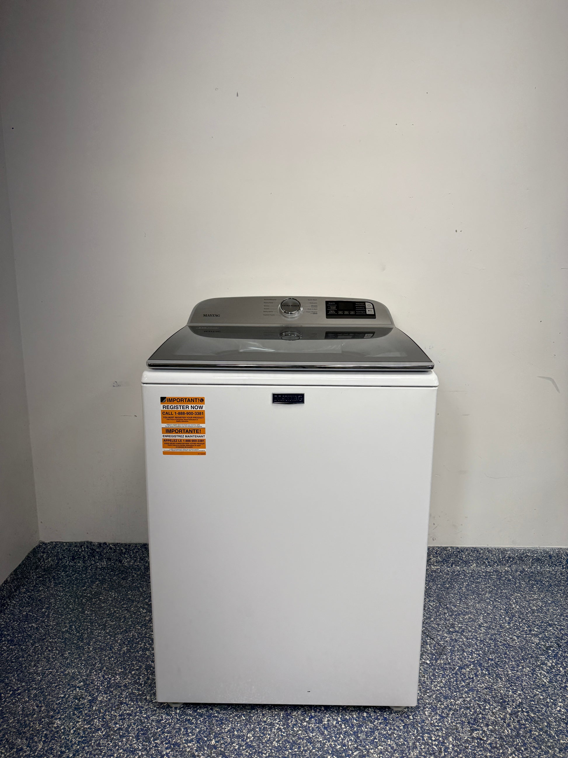 A full frontal image of the Maytag MVW6230HW top-load washer, highlighting its clean white finish and control panel. On sale at Appliance Shark - Scratch & Dent store | Kansas City.