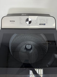 A front view of the MAYTAG MVW6500MBK washer, highlighting its built-in water faucet, ready for installation in a Kansas City laundry room.