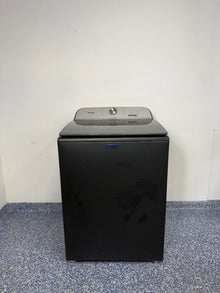 A full frontal image of the MAYTAG MVW6500MBK Top Load Pet Pro Washing Machine, highlighting its Volcano Black finish. On sale at Appliance Shark - Scratch & Dent store | Kansas City.