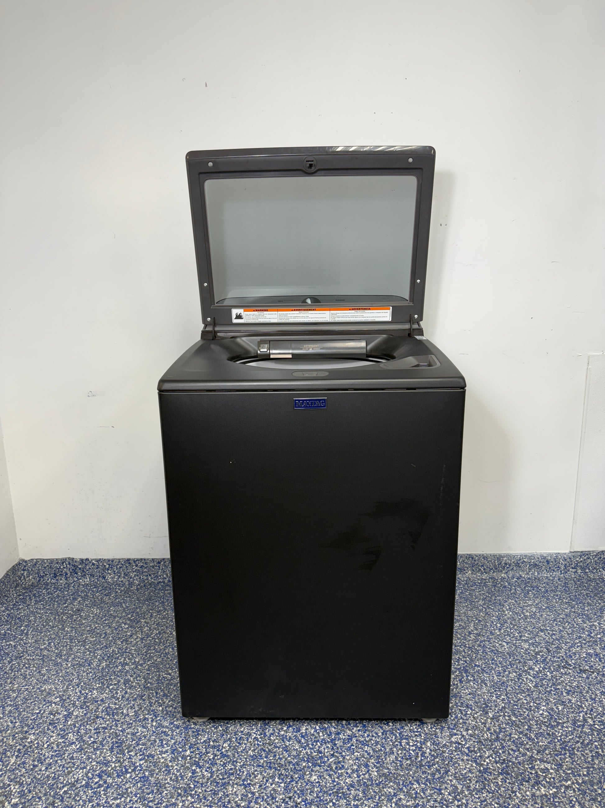A close-up of the stainless steel wash basket and agitator with the built-in Pet Pro Filter inside the MVW6500MBK. On sale at Appliance Shark - Scratch & Dent store | Kansas City.