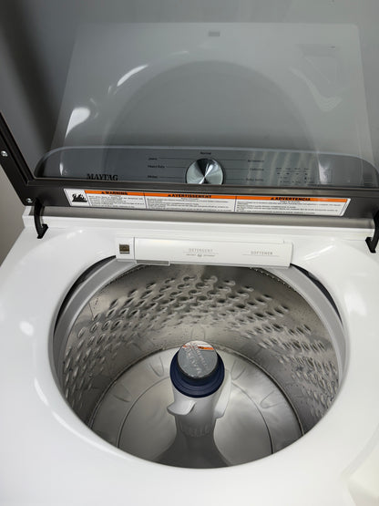 A close-up of the durable stainless steel wash basket and agitator inside the MVW6500MW washer, designed for tough messes. On sale at Appliance Shark - Scratch & Dent store | Kansas City.