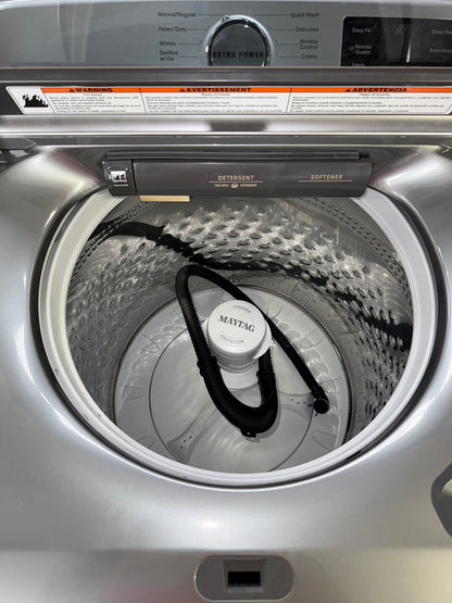 A front view of the MAYTAG MVW7230HC washer, highlighting its built-in water faucet, ready for installation in a Kansas City laundry room.