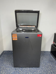 An overhead shot of the Maytag MVW7230HC with the lid open, showcasing the spacious stainless steel tub and agitator. On sale at Appliance Shark - Scratch & Dent store | Kansas City.