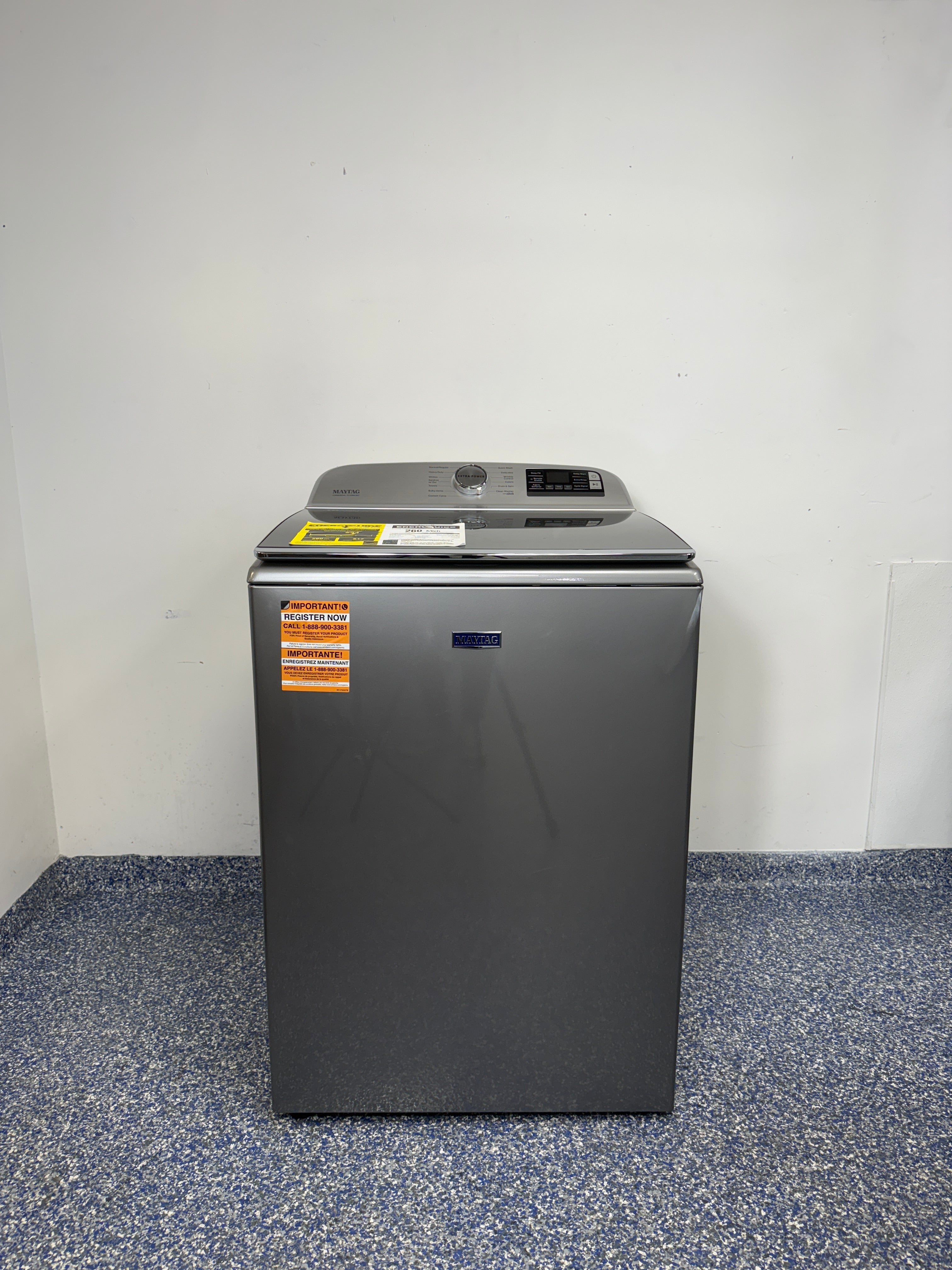 A full frontal image of the Maytag MVW7230HC top-load washing machine, highlighting its Metallic Slate finish and control panel. On sale at Appliance Shark - Scratch & Dent store | Kansas City.