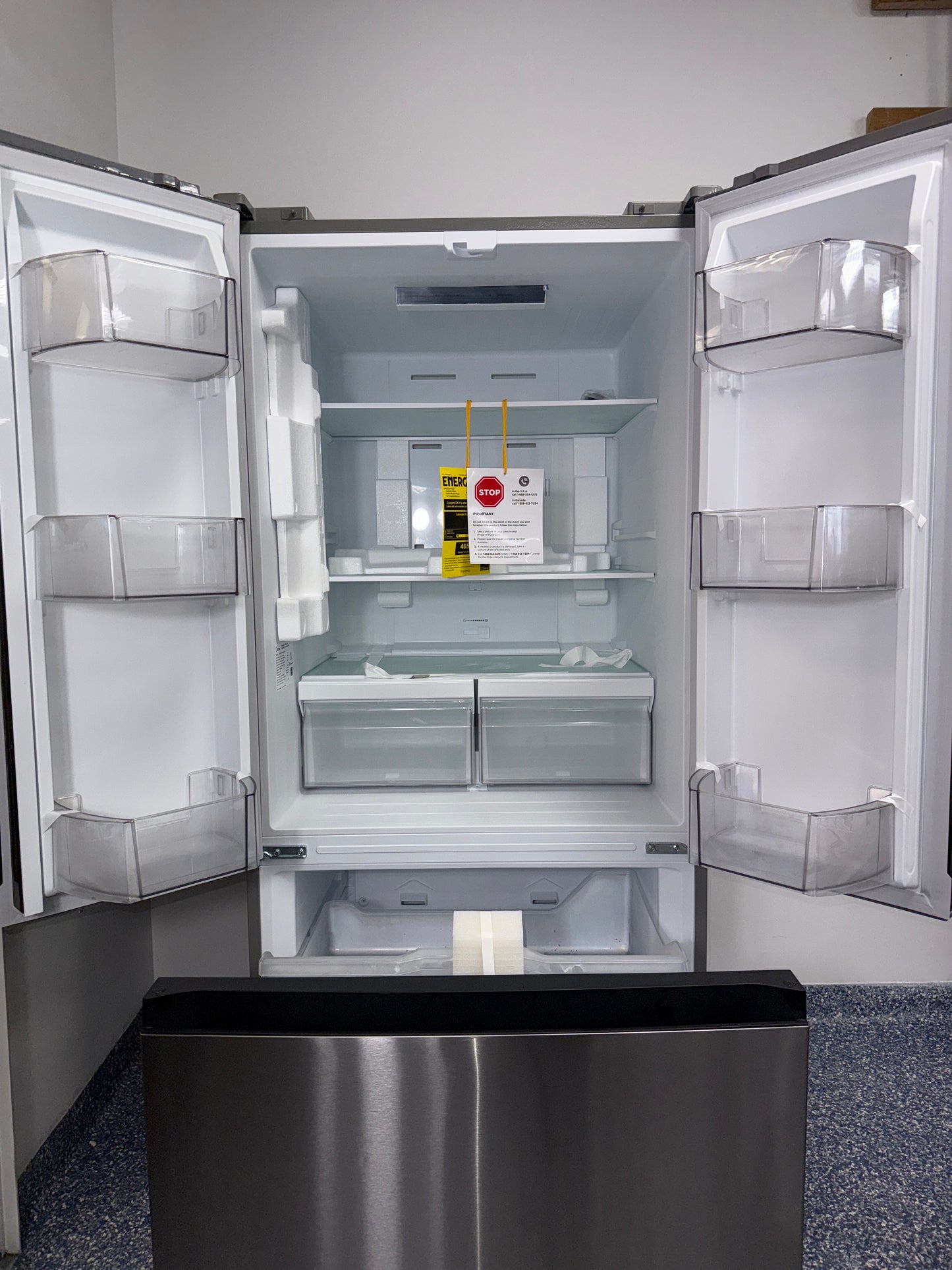 The interior of the MIDEA MRF18B4AST refrigerator, showing its spacious 18.4 cu. ft. capacity, an ideal appliance for homes in Overland Park.