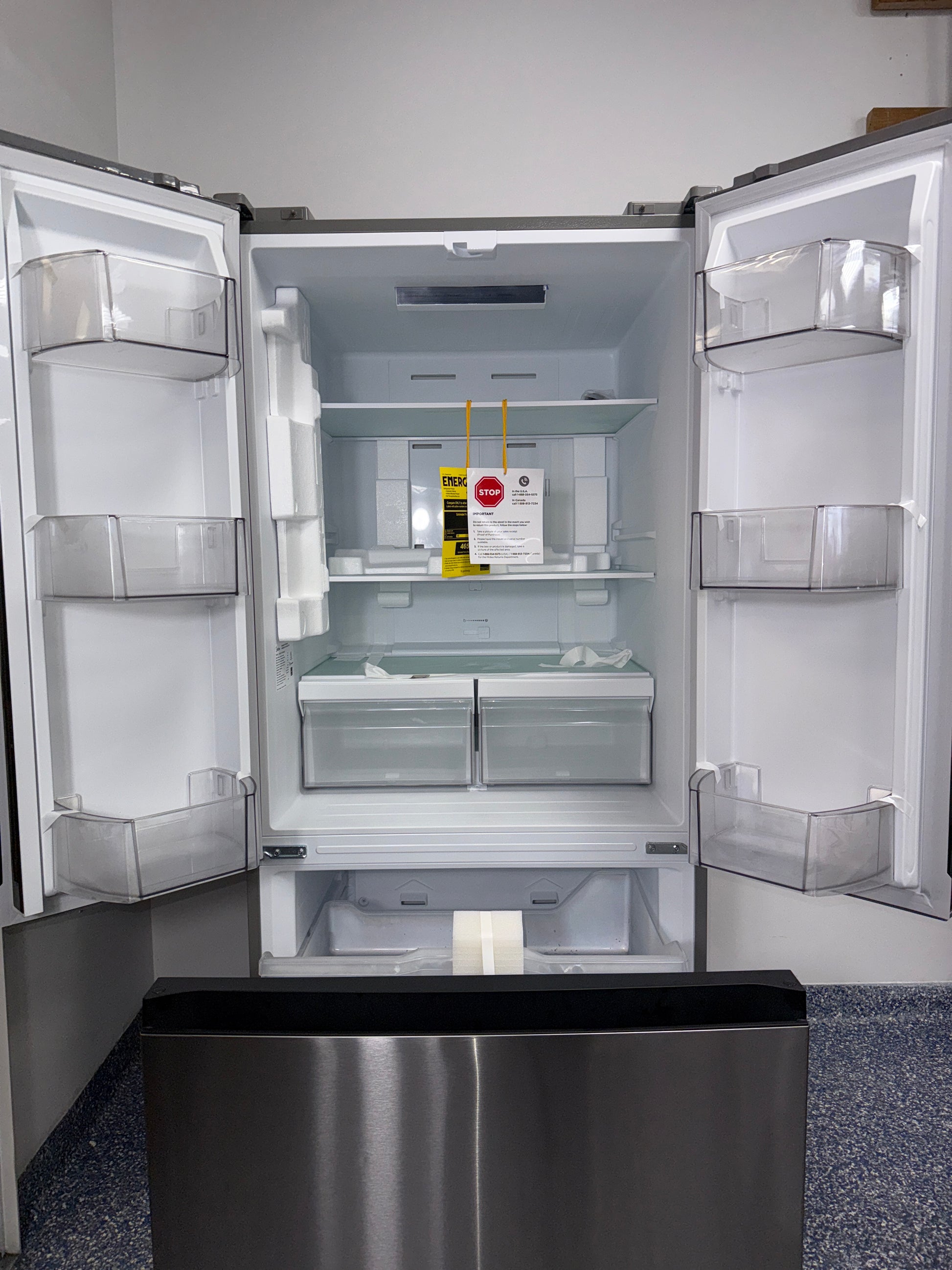 The interior of the MIDEA MRF18B4AST refrigerator, showing its spacious 18.4 cu. ft. capacity, an ideal appliance for homes in Overland Park.