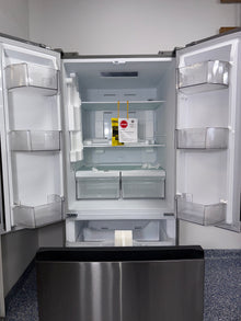 The interior of the MIDEA MRF18B4AST refrigerator, showing its spacious 18.4 cu. ft. capacity, an ideal appliance for homes in Overland Park.