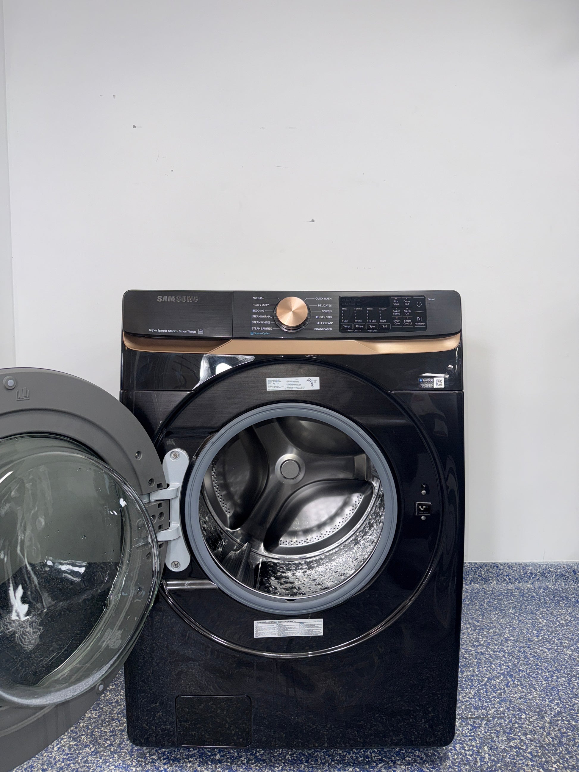 The SAMSUNG 5.0 cu. ft. front load washer, model WF50BG8300AVUS, available at Appliance Shark.
