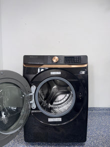 The SAMSUNG 5.0 cu. ft. front load washer, model WF50BG8300AVUS, available at Appliance Shark.