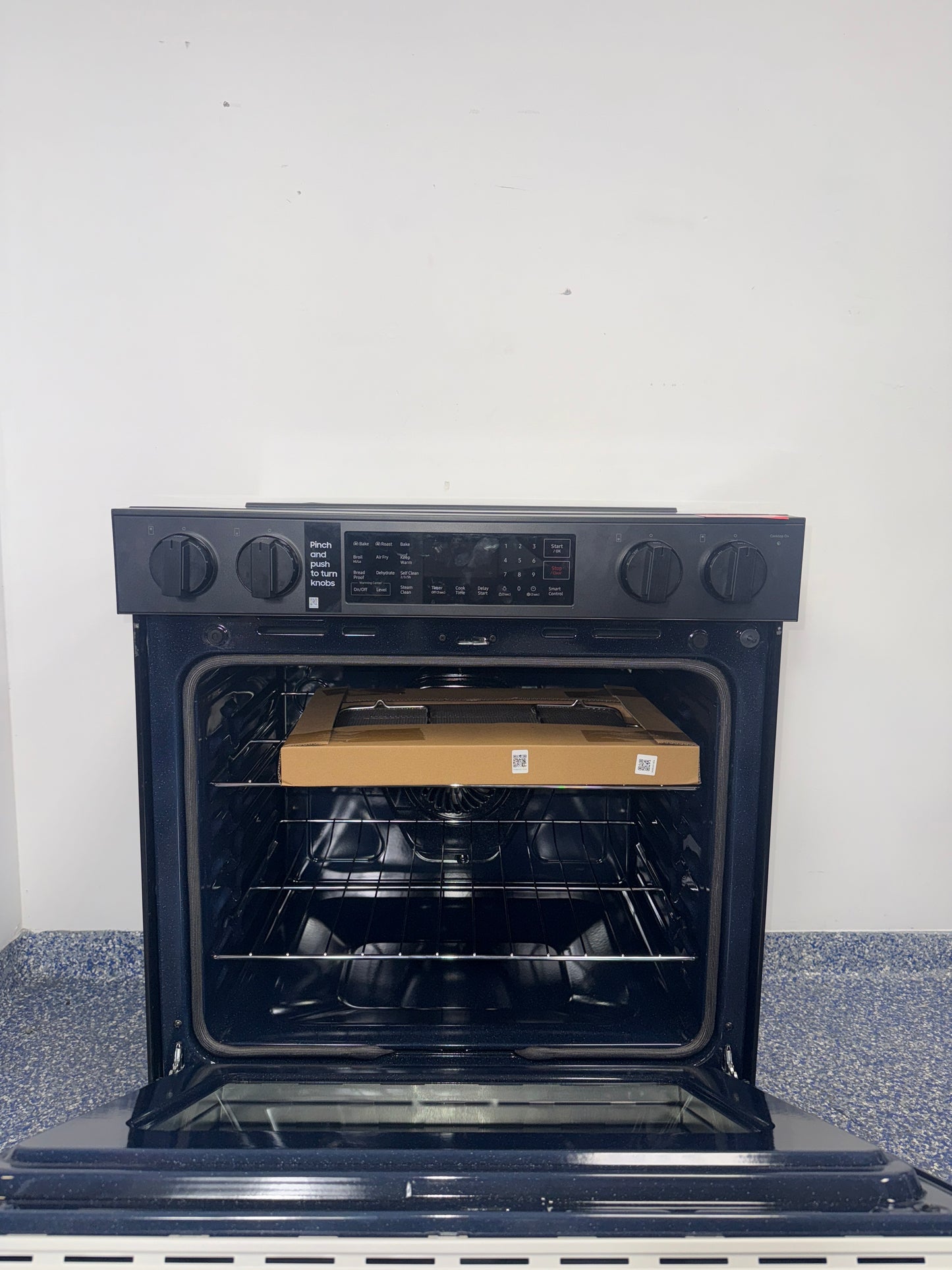 The SAMSUNG 6.3 cu. ft. electric range, model NSE6DB830012, available at Appliance Shark.