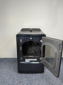 An overhead shot of the SAMSUNG DVE54CG7150D with the door open, showcasing the large drum interior and the included dryer rack. On sale at Appliance Shark - Scratch & Dent store | Kansas City.