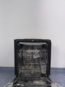 A view of the SAMSUNG DW80BB707012 dishwasher's interior, showing its convenient third rack for cutlery in an Overland Park home.
