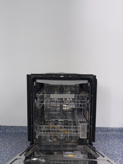 A view of the SAMSUNG DW80BB707012 dishwasher's interior, showing its convenient third rack for cutlery in an Overland Park home.