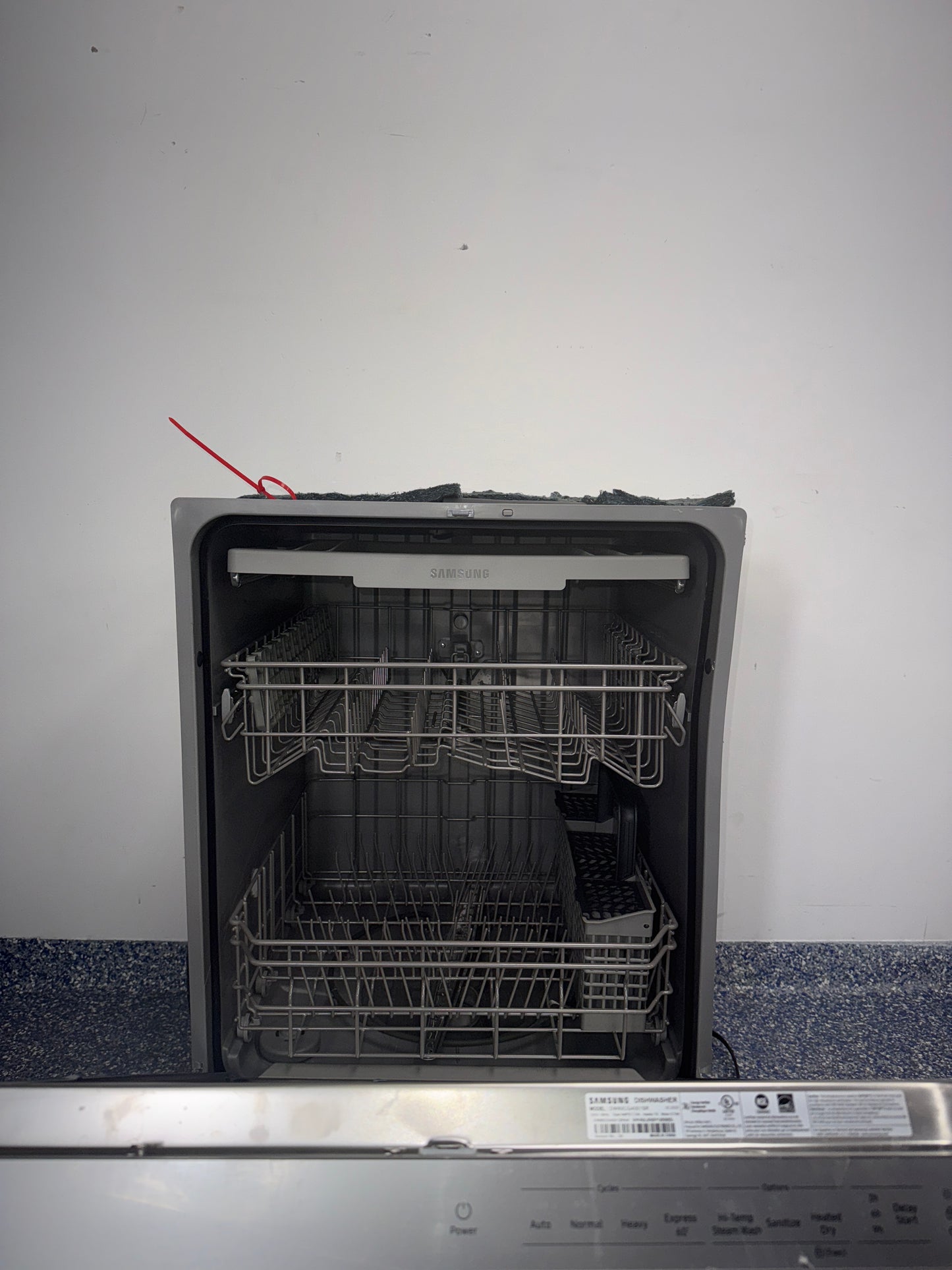 Interior view showing the 3rd rack of Samsung DW80CG4051SR with extra space for utensils in Overland Park, KS.