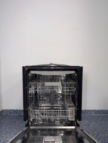 A view of the SAMSUNG DW80CG5451SR dishwasher's interior, showing its convenient 3rd rack for cutlery in a kitchen for sale in Kansas.

