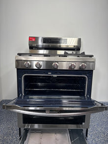 Scratch & dent SAMSUNG NX60A6751SS gas range displayed at Appliance Shark in Overland Park with modern slide-in design.