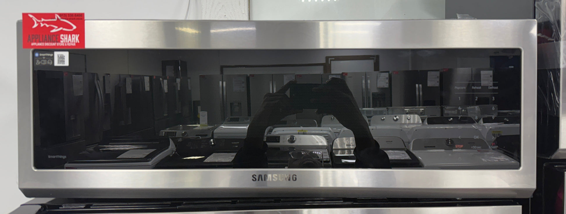 Front view of the SAMSUNG ME11A7710DS over-the-range microwave in stainless steel, available in Overland Park, KS.