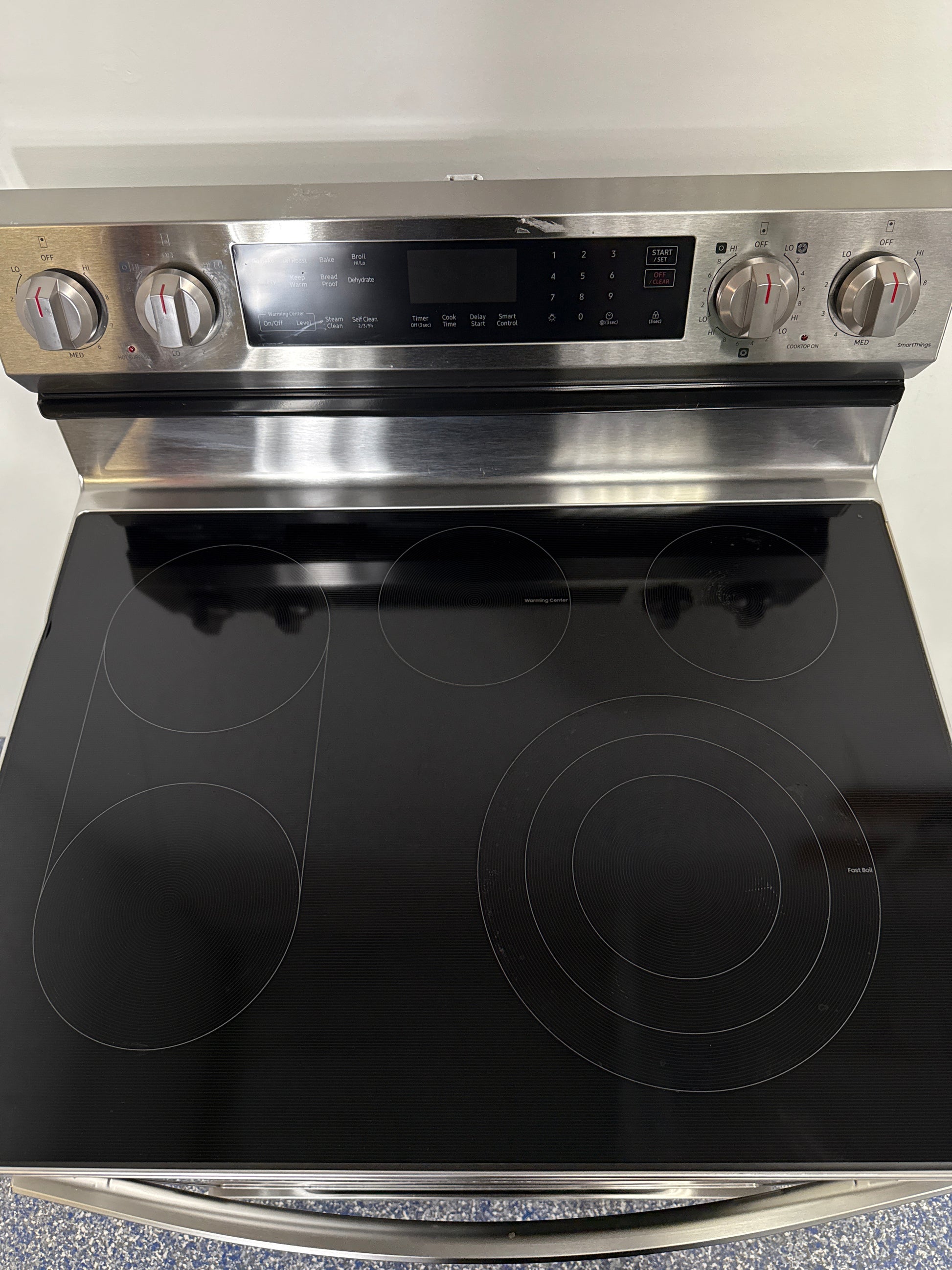 Convection cooking system of SAMSUNG NE63D6511SR electric range, discounted at Appliance Shark in Kansas City.