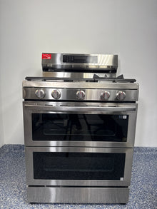 SAMSUNG NX60A6751SS smart slide-in gas range in stainless steel, available at Appliance Shark as the best scratch and dent gas range deal in Kansas City.