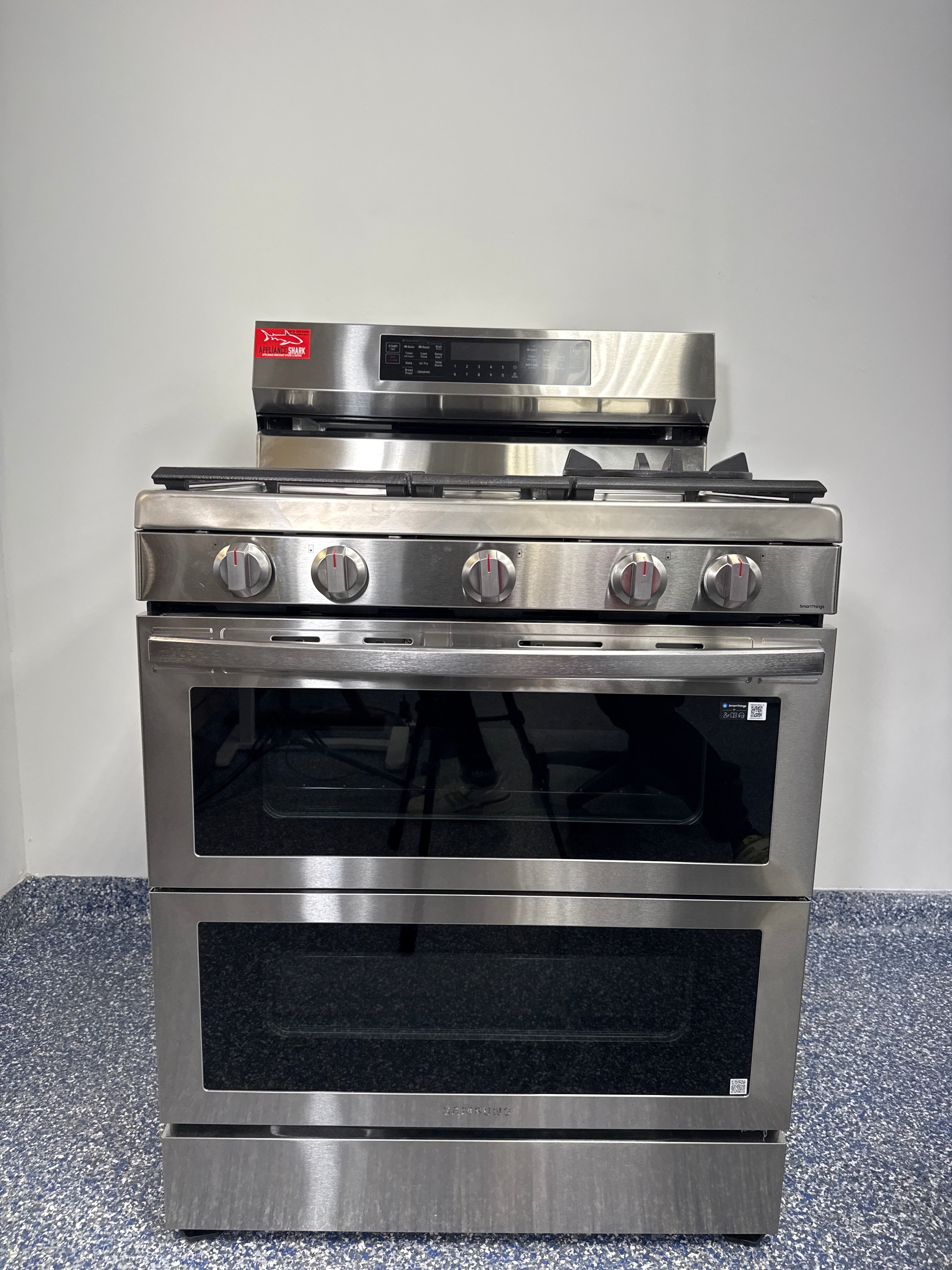 SAMSUNG NX60A6751SS smart slide-in gas range in stainless steel, available at Appliance Shark as the best scratch and dent gas range deal in Kansas City.
