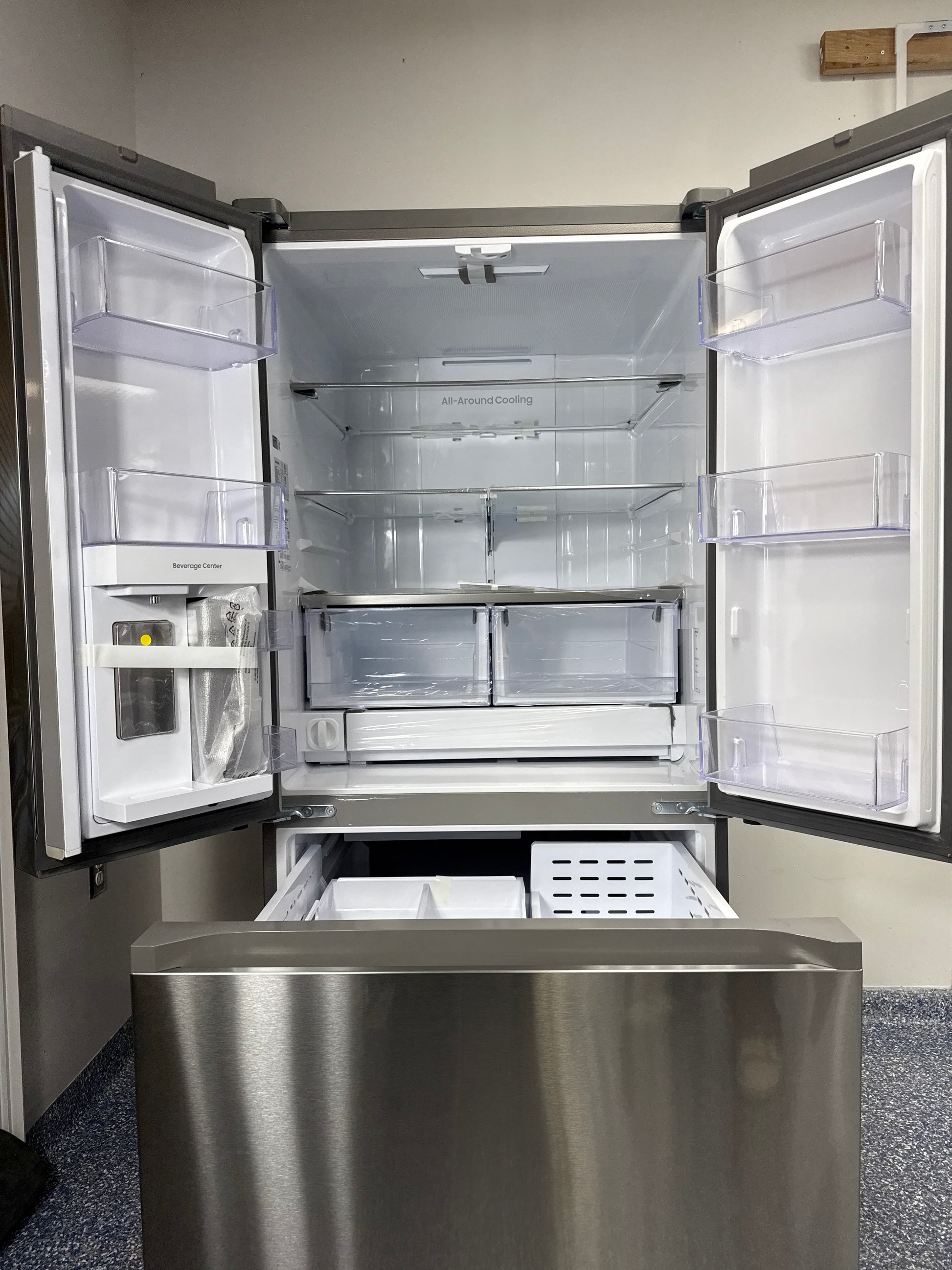 Scratch & dent SAMSUNG RF25C5551SR refrigerator displayed at Appliance Shark in Overland Park with Beverage Center convenience.