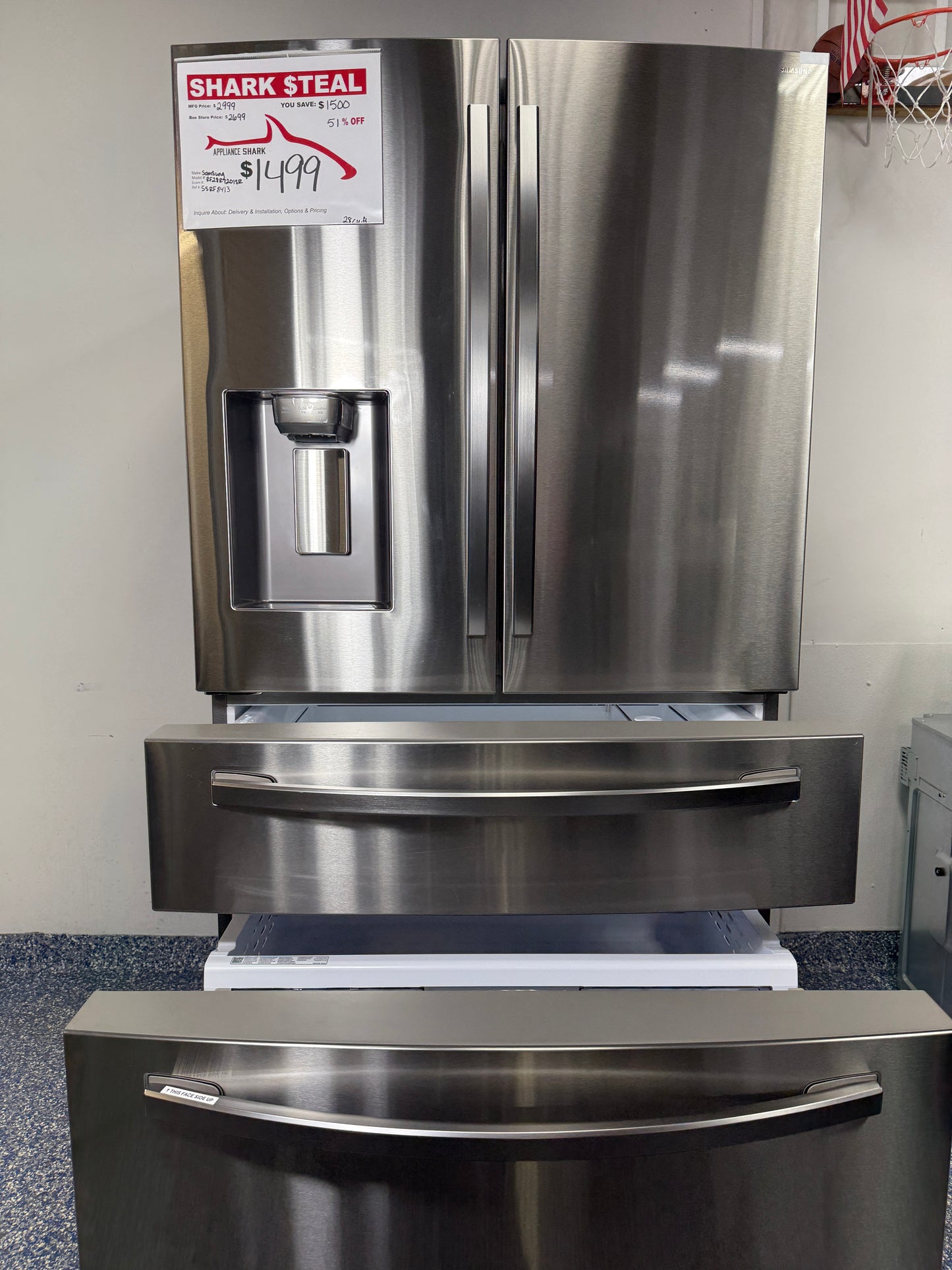 A view inside the bottom freezer drawer of the Samsung RF28R7201SR, showcasing the large capacity and divided storage. On sale at Appliance Shark - Scratch & Dent store | Kansas City.