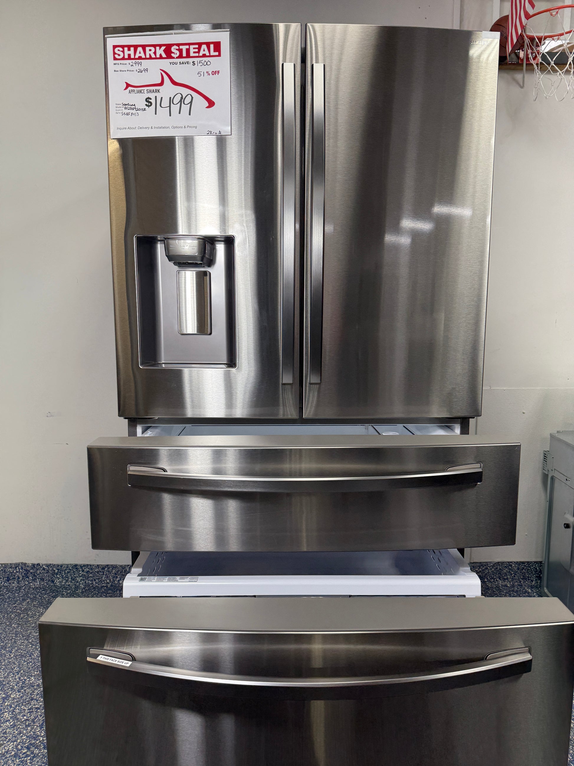 A view inside the bottom freezer drawer of the Samsung RF28R7201SR, showcasing the large capacity and divided storage. On sale at Appliance Shark - Scratch & Dent store | Kansas City.