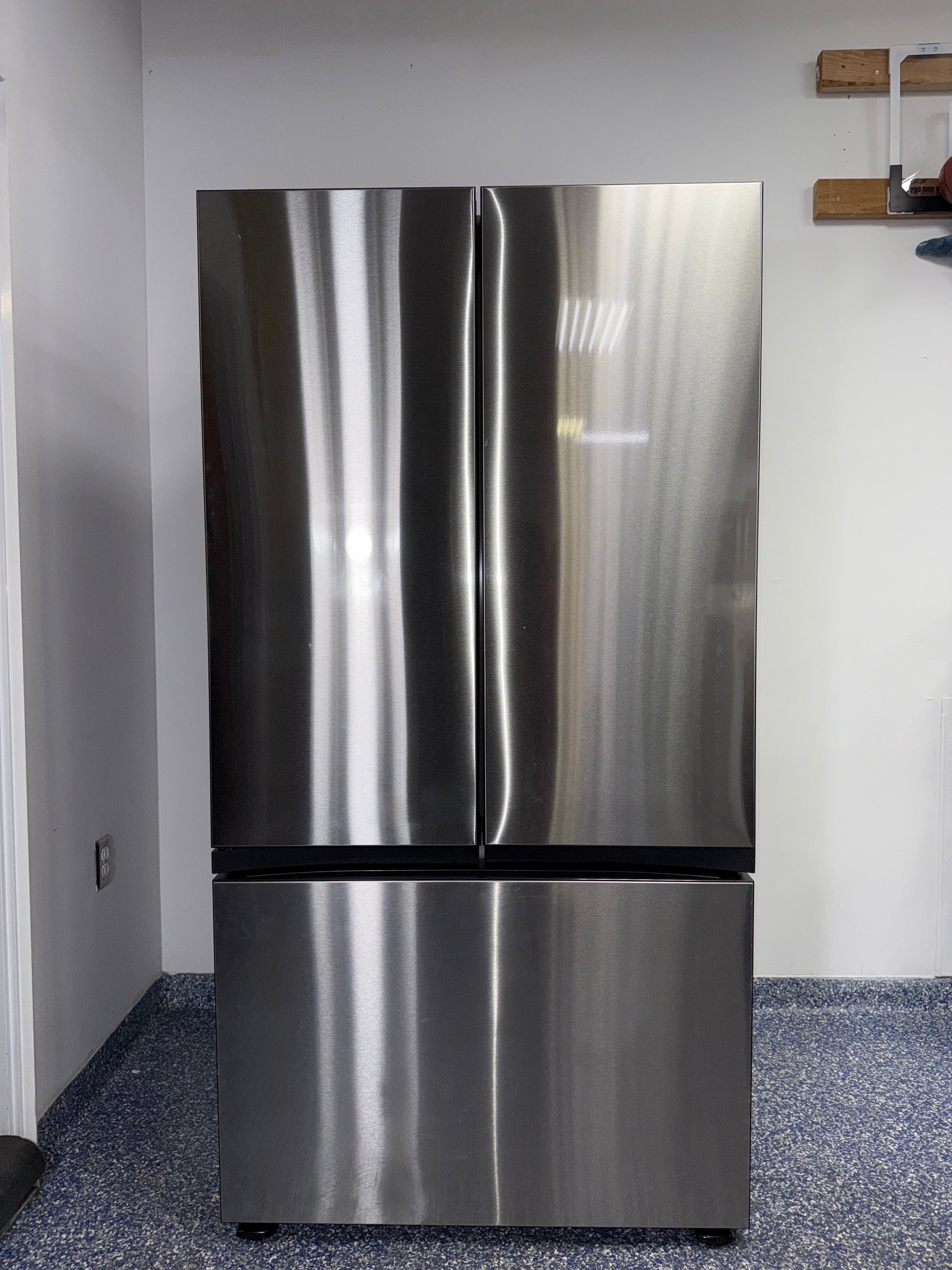 Front view of the SAMSUNG RF30BB6600QLAA 30.1 cu ft Bespoke 3-Door French-Door refrigerator in stainless steel, available in Overland Park, KS.