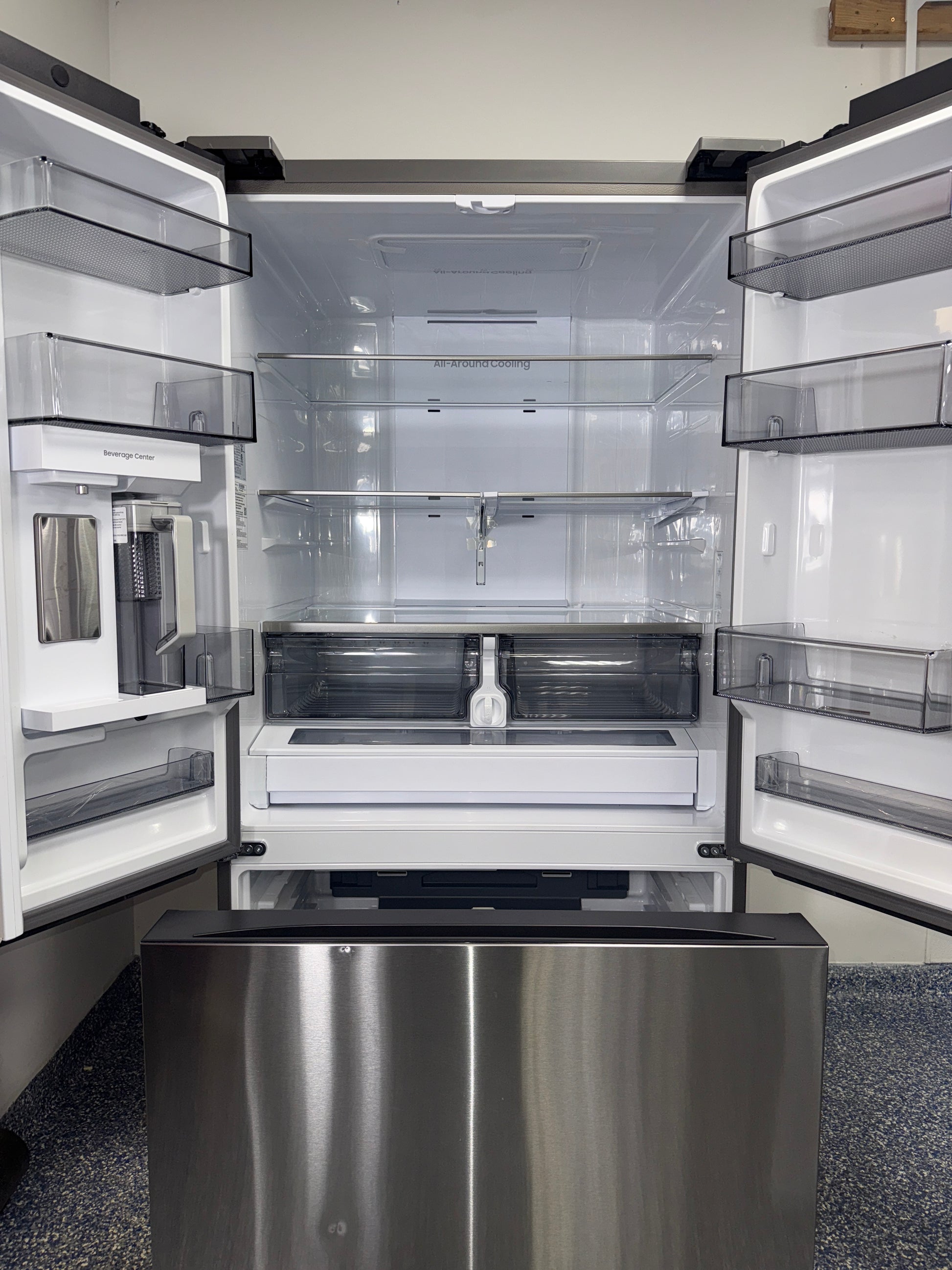 A close-up of the full-width drawer in the SAMSUNG refrigerator, model RF32CG5300SR, for sale in Kansas.
