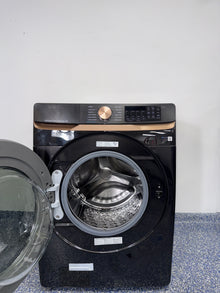 A close-up view of the interior of the SAMSUNG WF50BG8300AVUS washer, showcasing its Self Clean+ feature, an ideal appliance for homes in Overland Park.