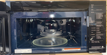 The SAMSUNG over-the-range microwave featuring Slim Fry technology, an ideal appliance for homes in Overland Park.