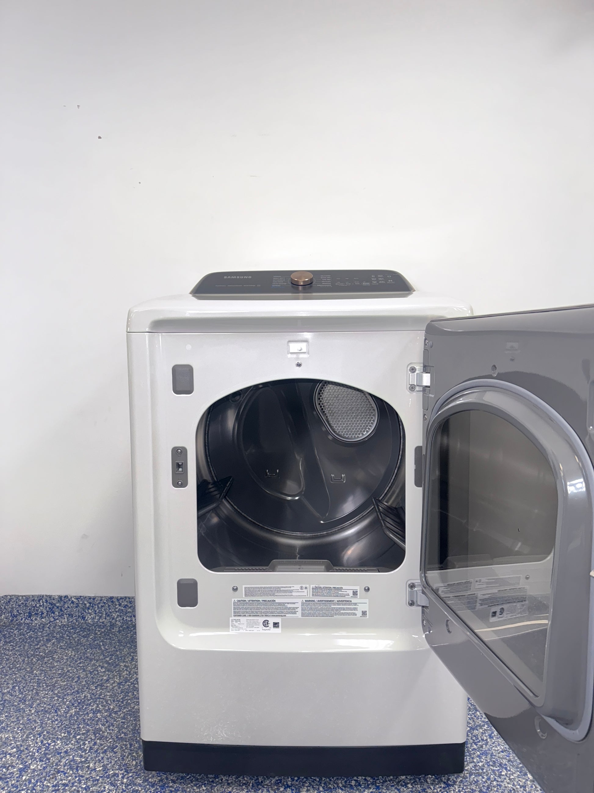 A view of the control panel and door on the SAMSUNG DVG55CG7500E dryer, showcasing its Steam Sanitize+ option, perfect for an Overland Park, KS home.