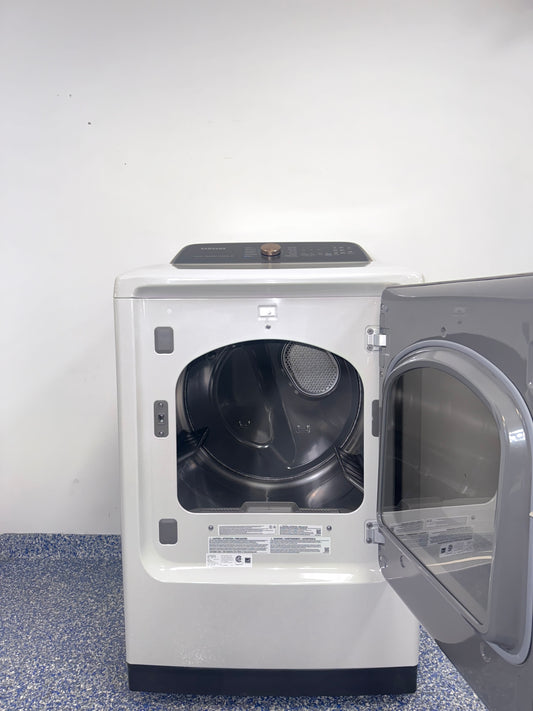 A view of the control panel and door on the SAMSUNG DVG55CG7500E dryer, showcasing its Steam Sanitize+ option, perfect for an Overland Park, KS home.