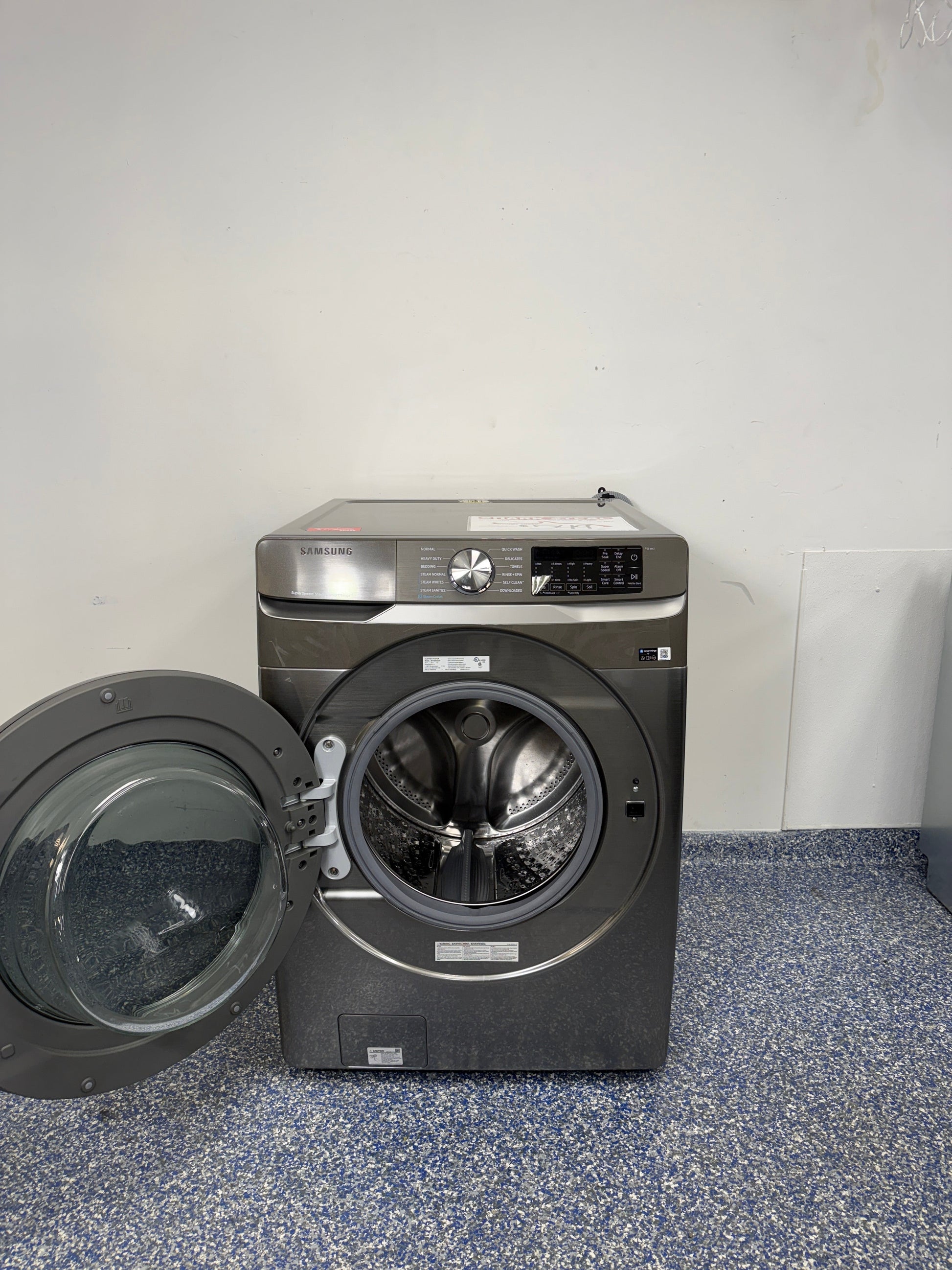 A close-up view of the interior of the SAMSUNG WF45B6300AP washer, showcasing its Steam Wash feature, perfect for an Overland Park, KS home.