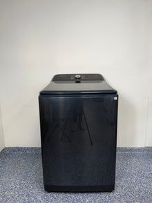 A full frontal image of the SAMSUNG WA54CG7150AD top-load washing machine, highlighting its Brushed Black finish and clean design. On sale at Appliance Shark - Scratch & Dent store | Kansas City.