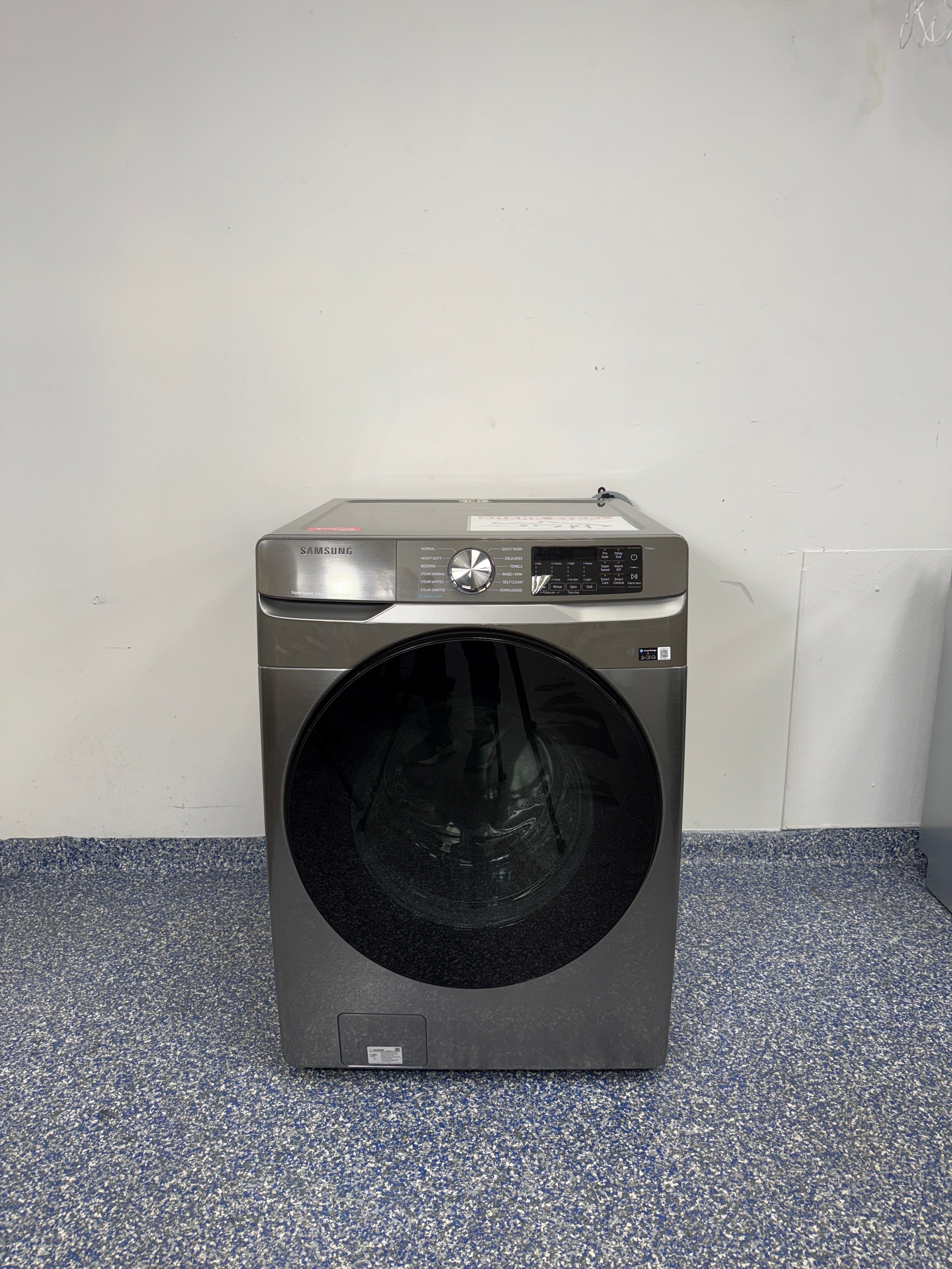 The SAMSUNG WF45B6300AP front load washer from the front, highlighting its Super Speed Wash feature and a great deal in Kansas.