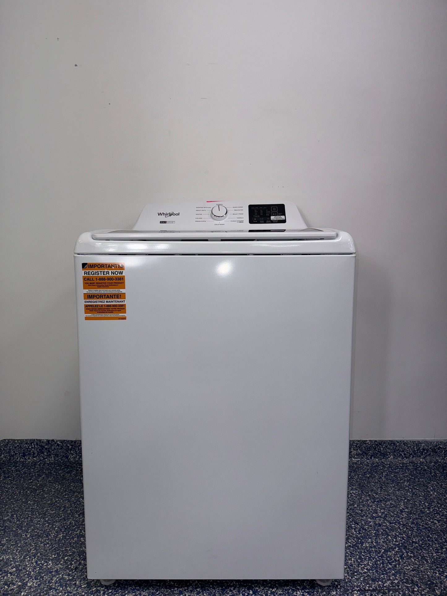 The interior of the WHIRLPOOL WTW4307SW washer, showing the stainless steel wash basket, an ideal appliance for homes in Overland Park, KS.