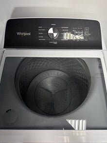 The interior of the WHIRLPOOL WTW5020SW washer, showing the Smooth Impeller and Auto Sensing technology, an ideal appliance for homes in Overland Park.