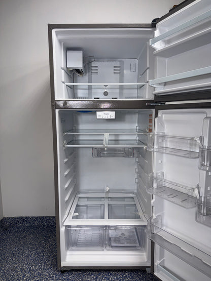 The interior of the WHIRLPOOL refrigerator, model WRT518SZFM, showing its frameless glass shelves, an ideal appliance for homes in Overland Park.