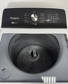 The interior of the WHIRLPOOL WTW5057LW washer, showing the Smooth Impeller and Auto Sensing technology, an ideal appliance for homes in Overland Park, KS.