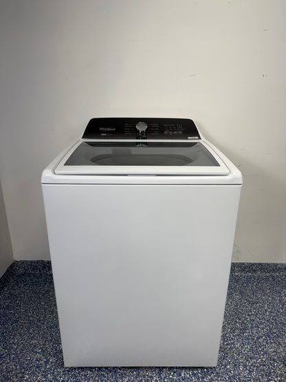 A full frontal photo of the WHIRLPOOL WTW5057LW top-load washing machine, showcasing its clean white finish and knob controls. Find this scratch & dent discount at our Kansas City store.