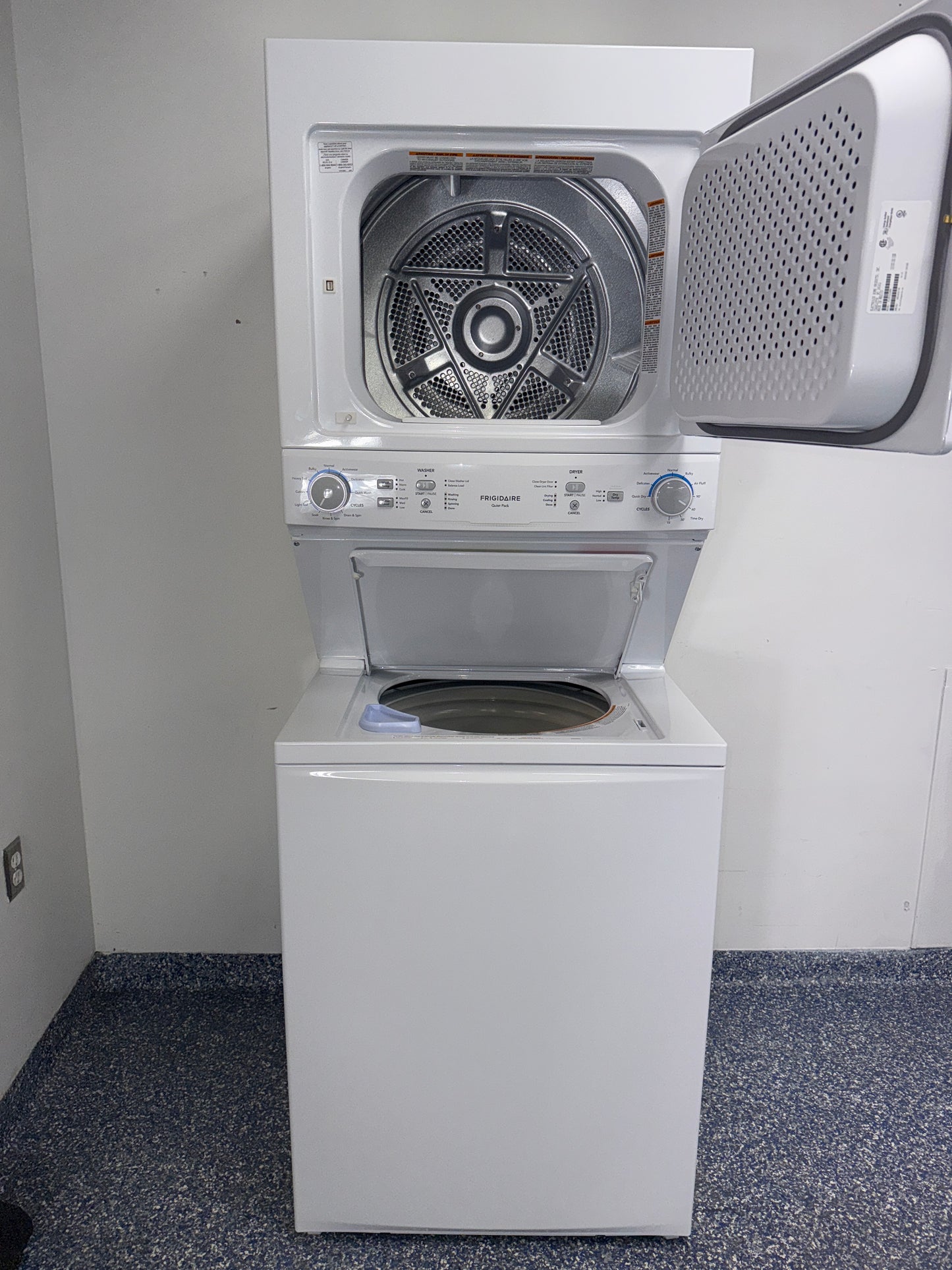 Installed profile view of the WHIRLPOOL WET4024HW0 front load washer in a Kansas City Metro laundry room.