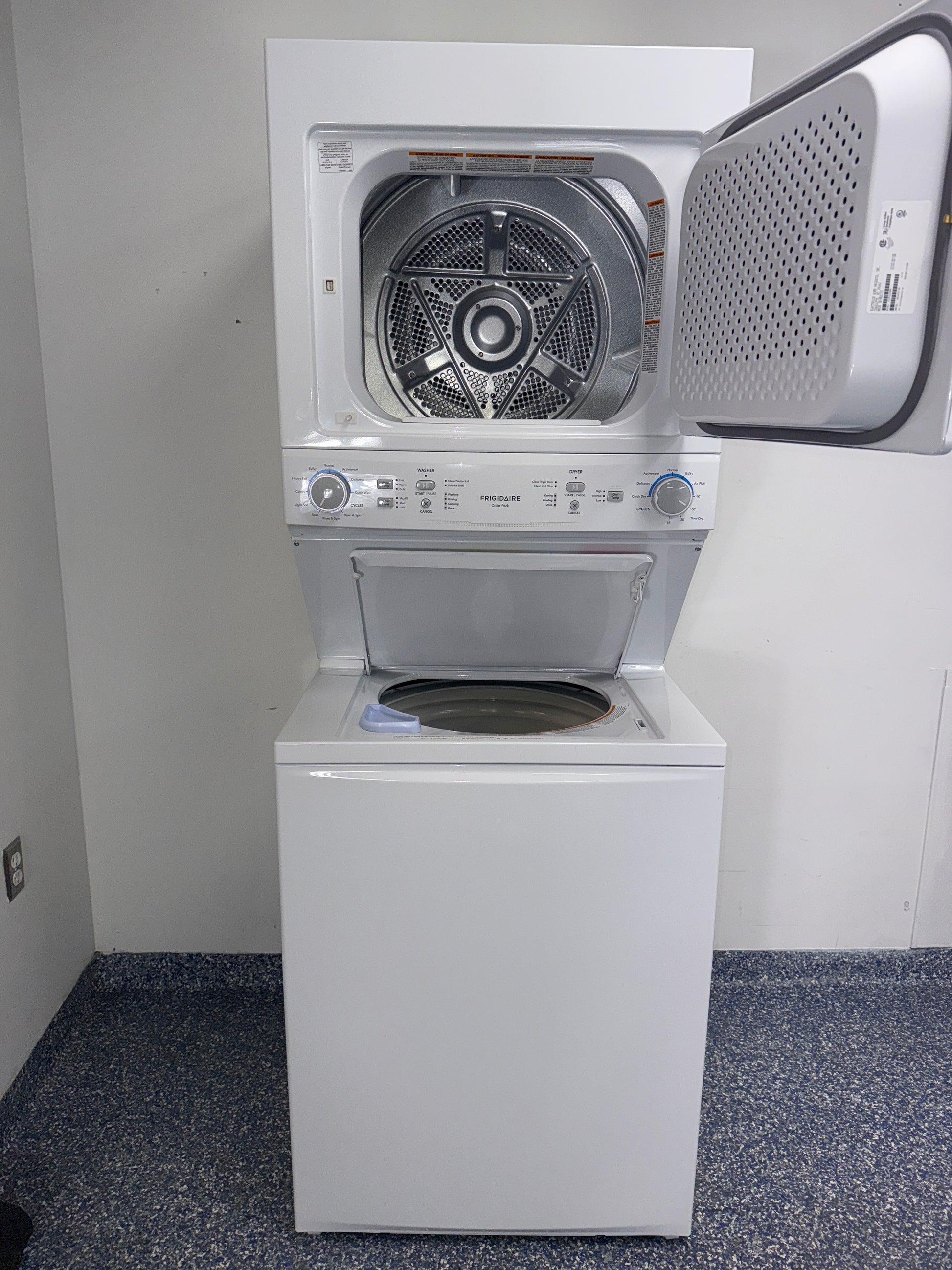 Installed profile view of the WHIRLPOOL WET4024HW0 front load washer in a Kansas City Metro laundry room.