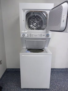Installed profile view of the WHIRLPOOL WET4024HW0 front load washer in a Kansas City Metro laundry room.