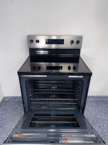 Smooth glass cooktop of the WHIRLPOOL WFES3330RZ2 electric range in the Kansas City area.