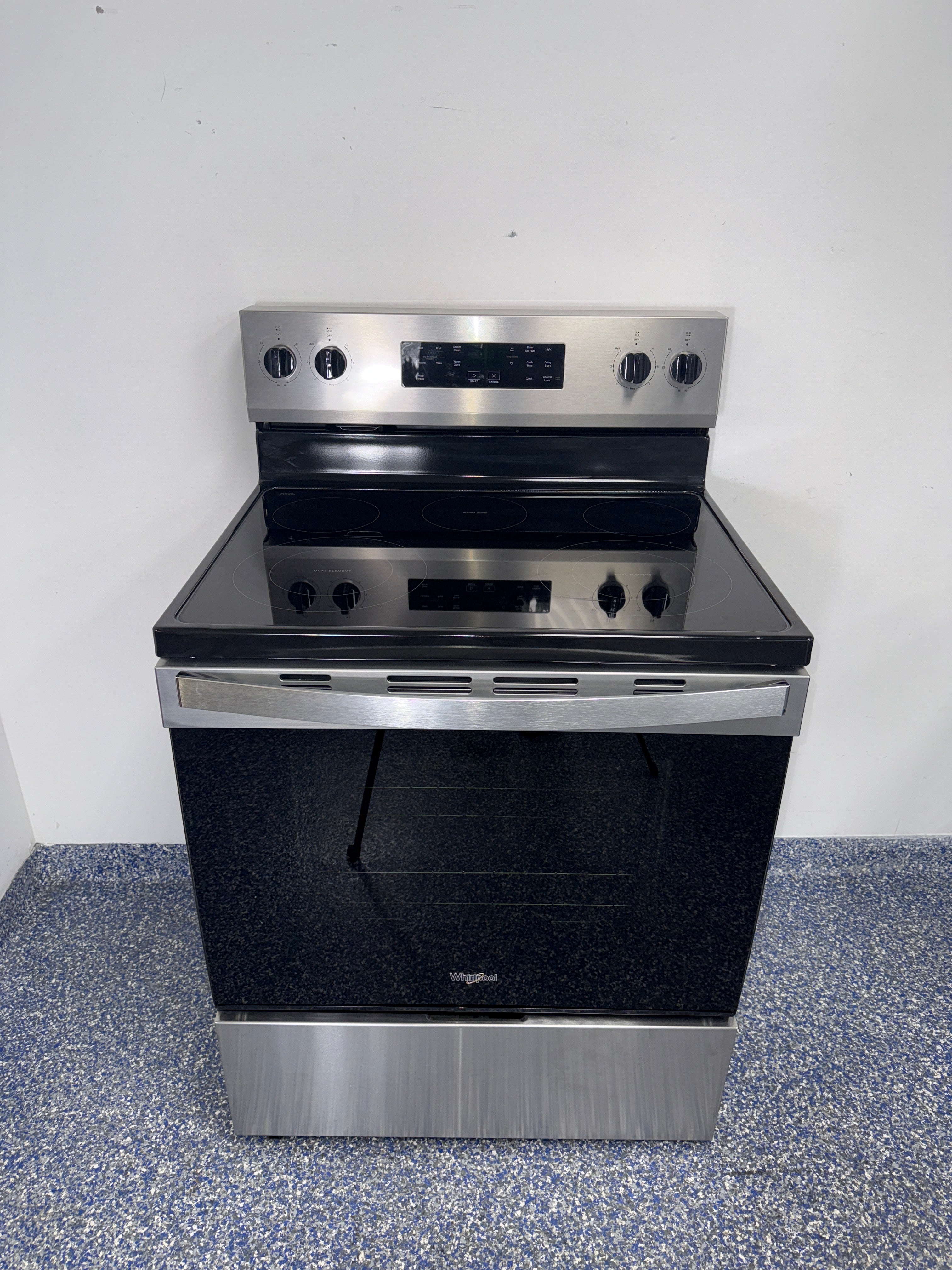 Front view of the WHIRLPOOL WFES3330RZ2 electric range in Overland Park, KS.
