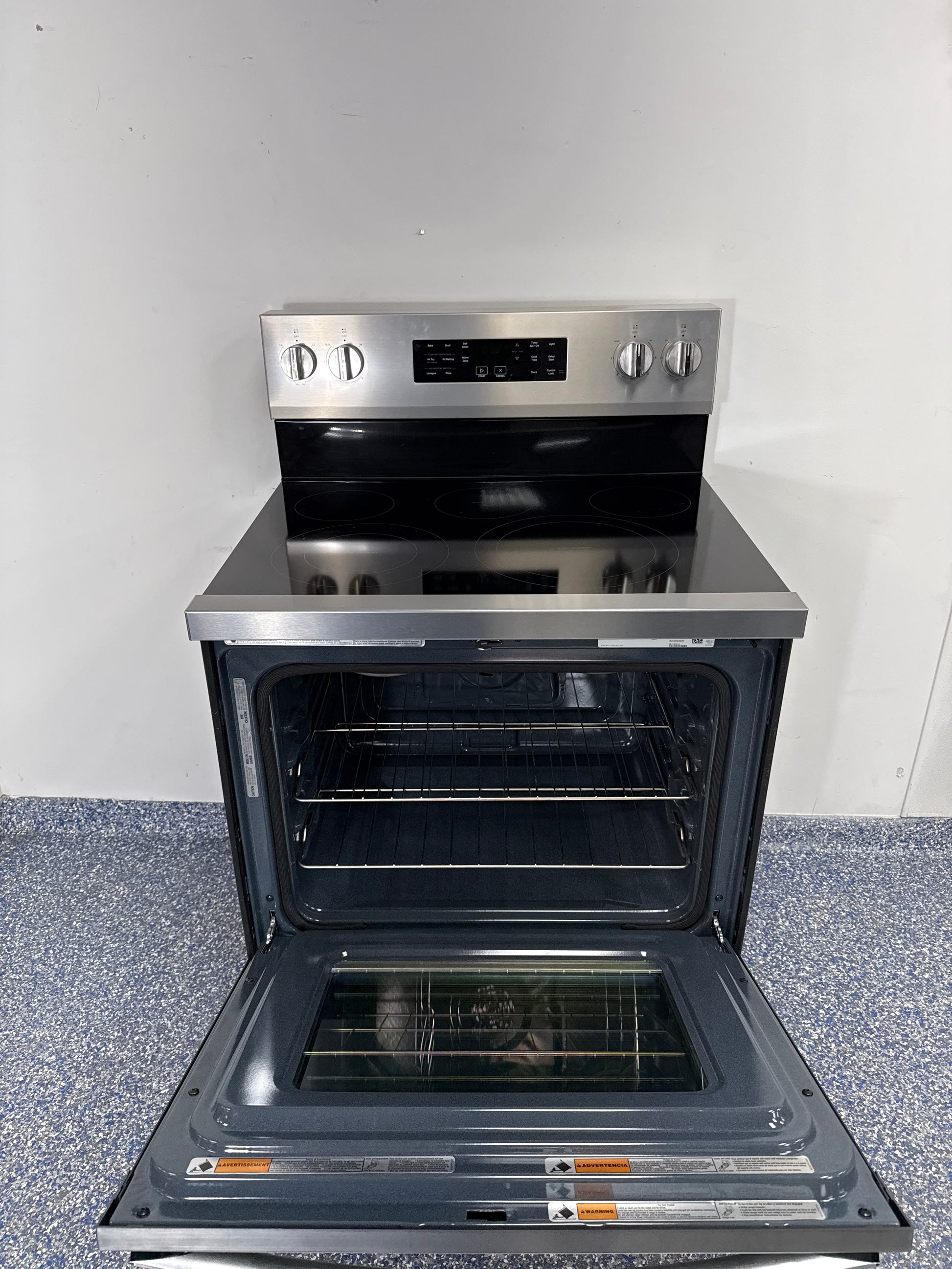 Control panel and cooking modes on the WHIRLPOOL WFES5030RZ electric range in the Kansas City Metro area.